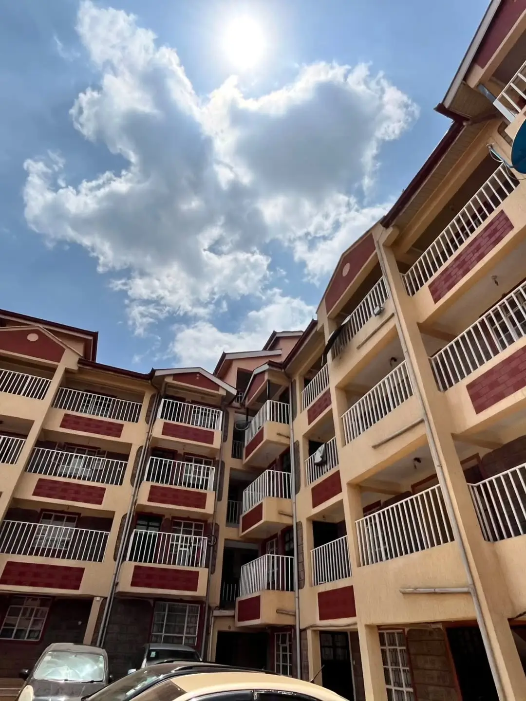 Multi-story residential building courtyard with balconies