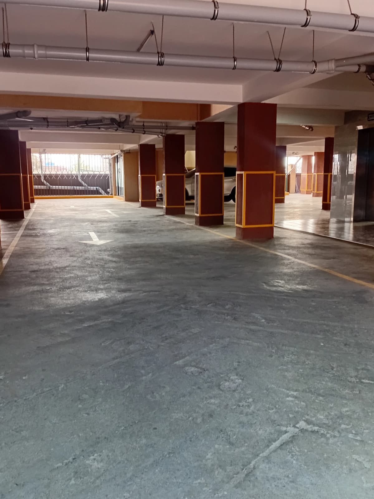 Large underground parking garage with support columns