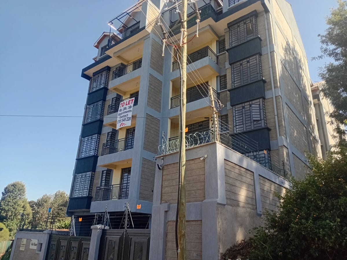 Modern multi-story residential building with yellow and blue facade