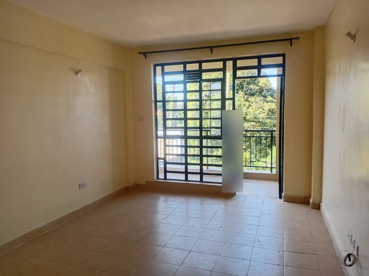 Bright living room with direct access to covered balcony