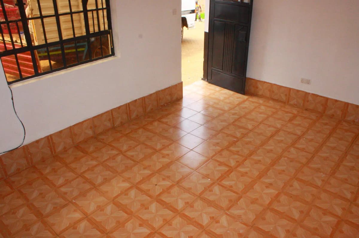 Spacious empty living room with terracotta tile flooring