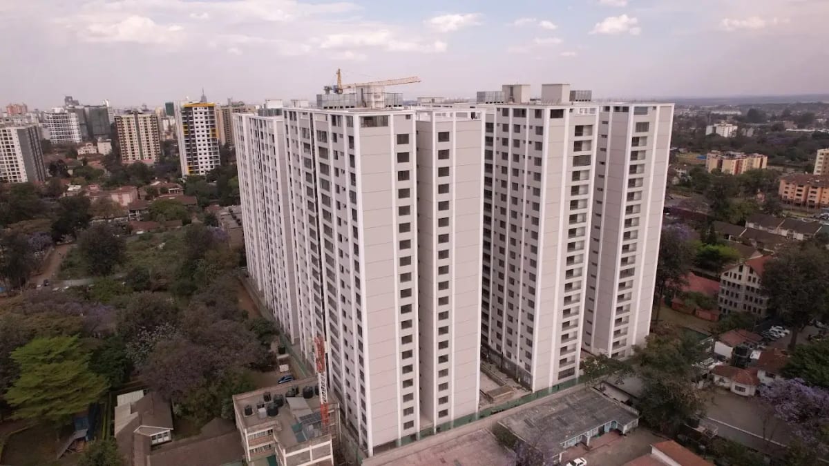 Aerial drone view of tall white residential apartment towers