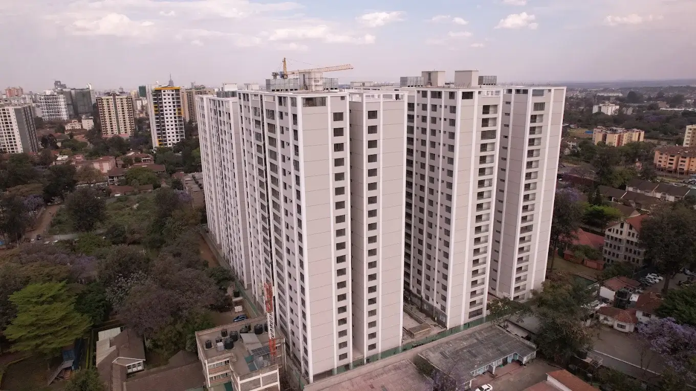 Aerial drone view of tall white residential apartment towers