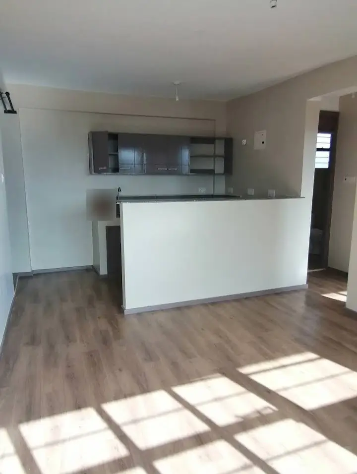Open-plan living area with modern white kitchen island