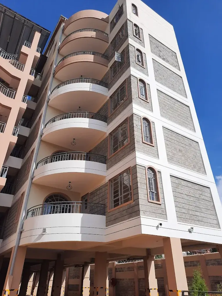 Modern multi-story residential building with curved balconies
