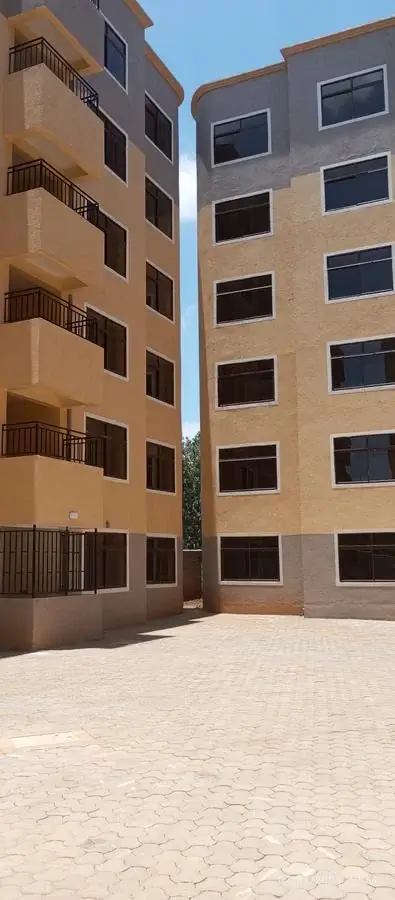 Multi-story residential building facade with balconies and courtyard