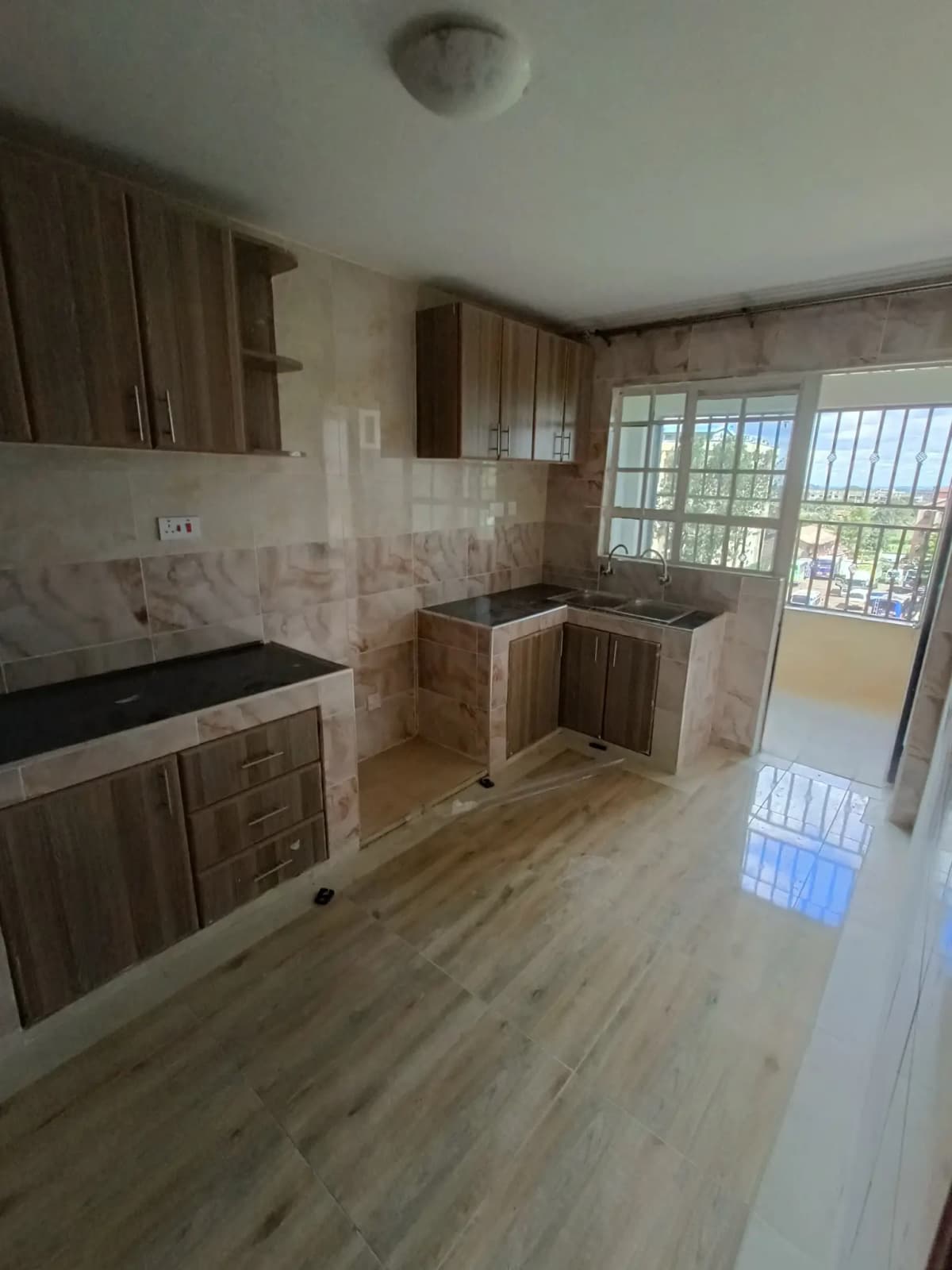 Modern kitchen with wooden cabinets and marble backsplash