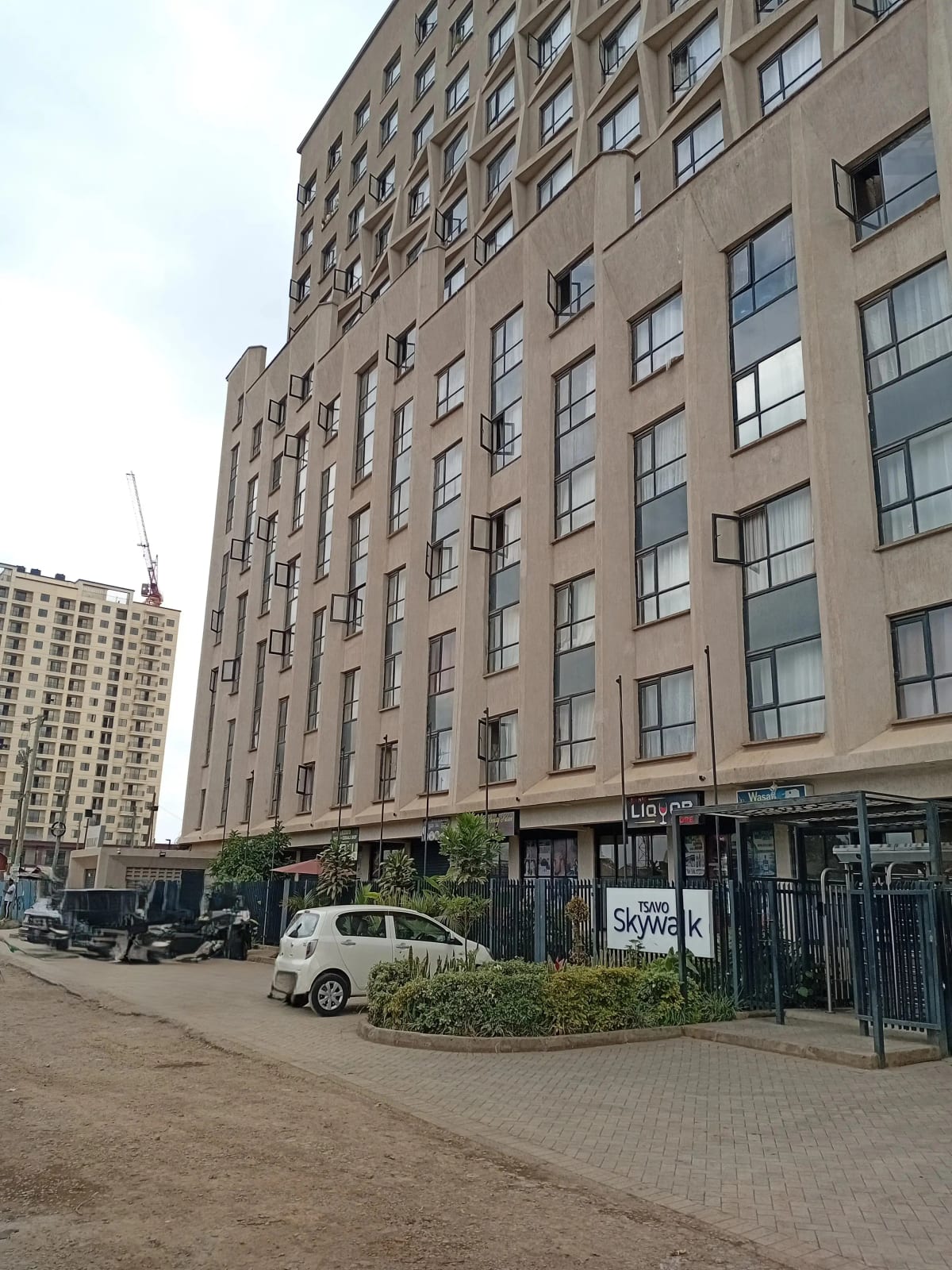 Mid-rise residential building facade with ground-floor retail