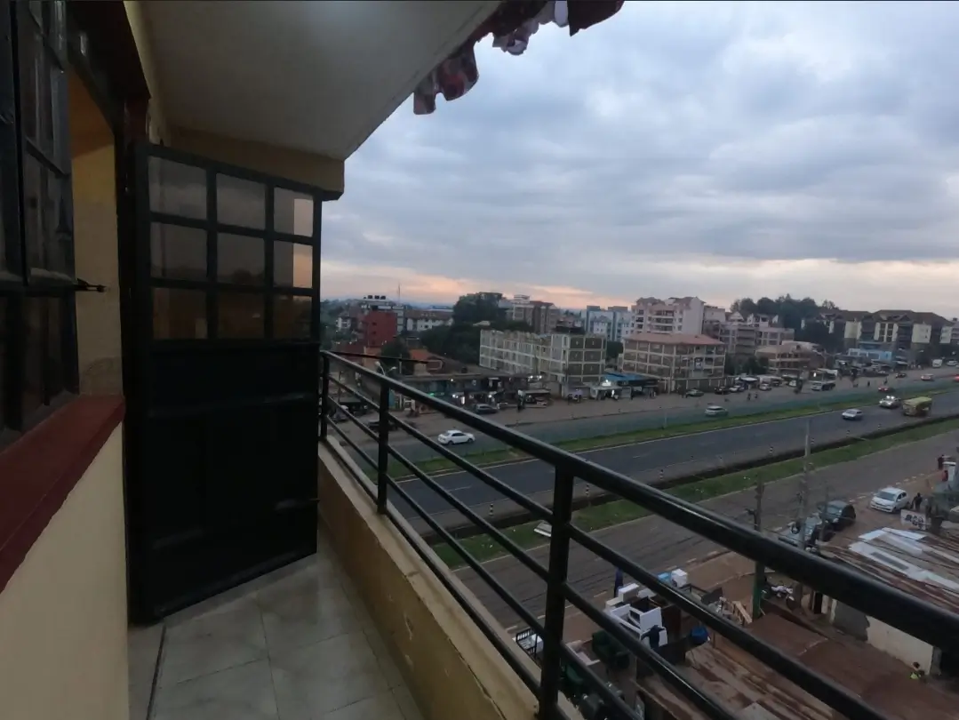 Balcony with city skyline and street view at dusk