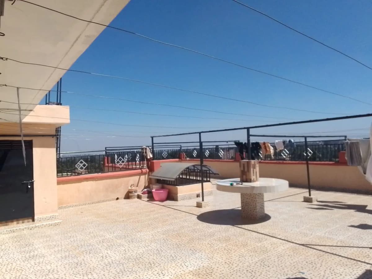 Rooftop terrace with city views and metal railings