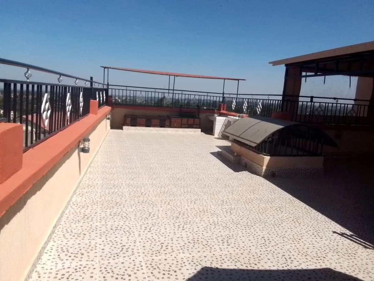 Rooftop terrace with paved flooring and city views