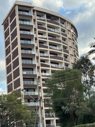 Multi-story residential tower with balconies and modern facade