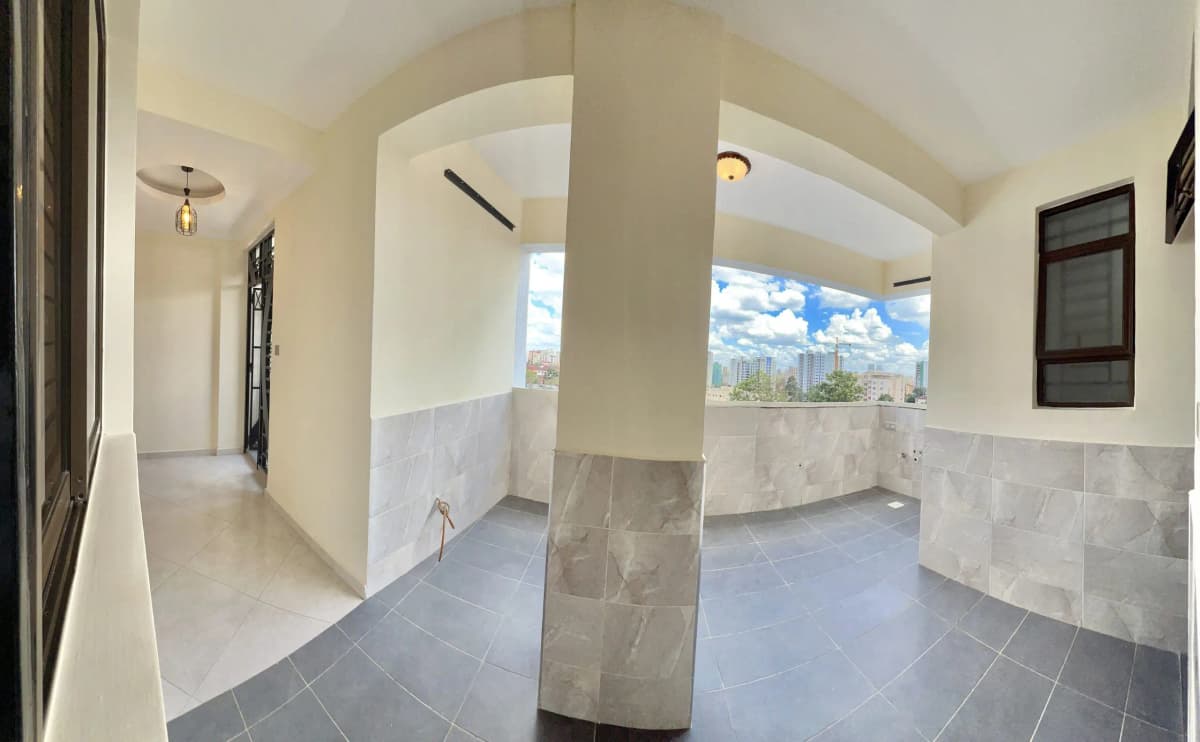 Open-air terrace with partial walls and sky views