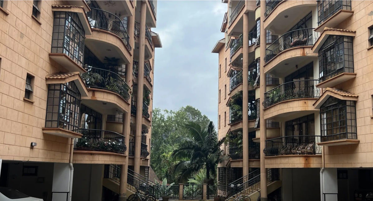 Multi-story residential building facade with curved balconies
