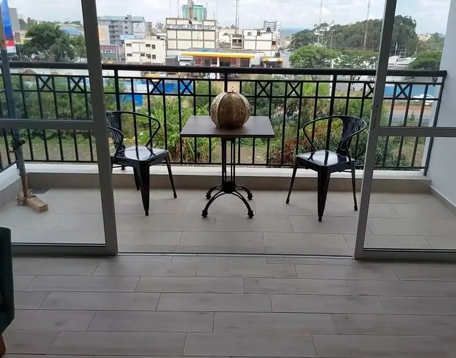 Elevated balcony with panoramic city and green space views
