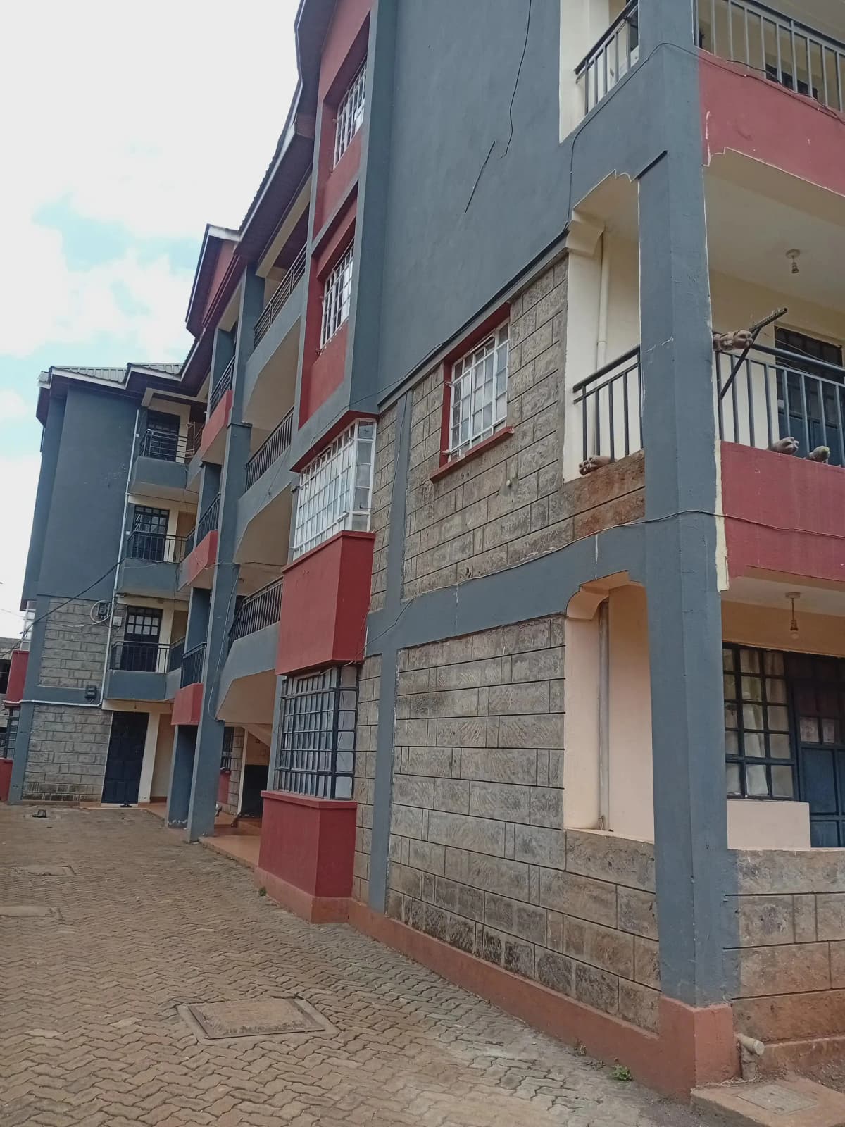 Multi-story residential building facade with colorful painted sections