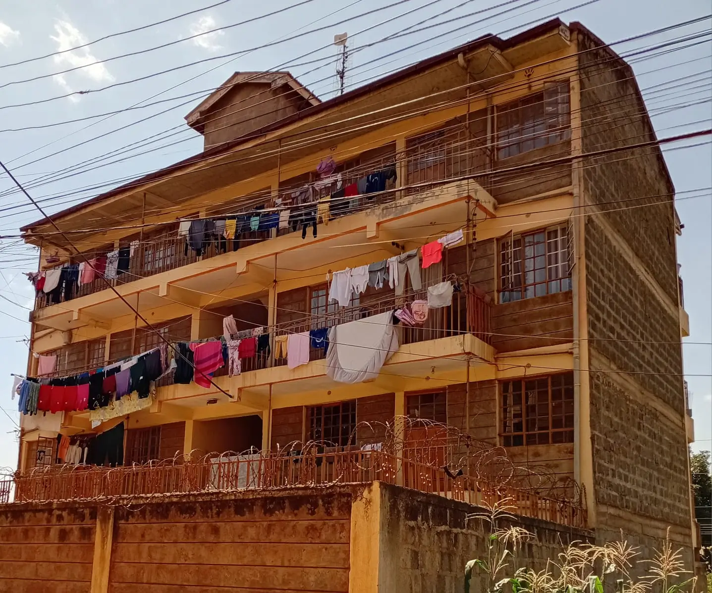 Multi-story residential building with laundry hanging on balconies