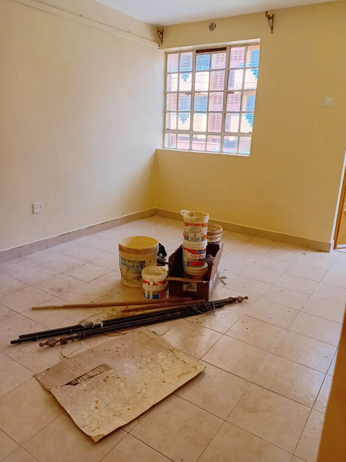 Empty bedroom during renovation with construction materials