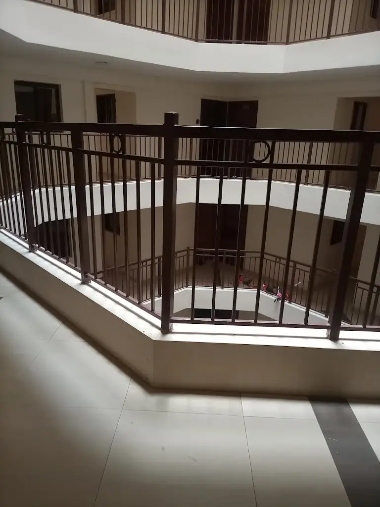 Multi-level building lobby with curved metal railings