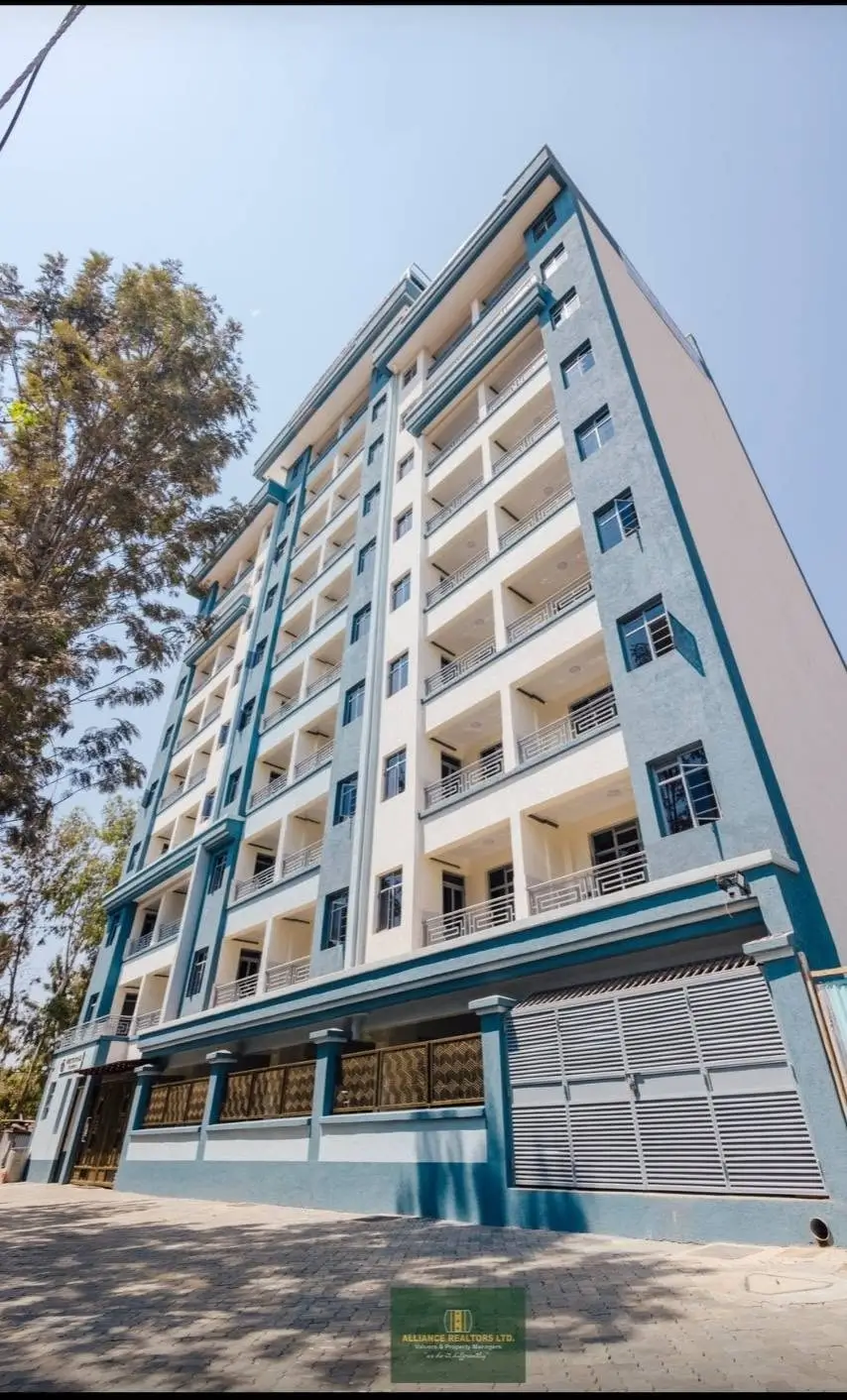 Multi-storey blue and white apartment building facade