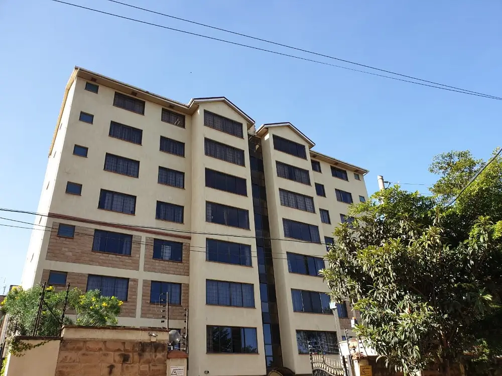 Multi-story residential apartment building facade with balconies